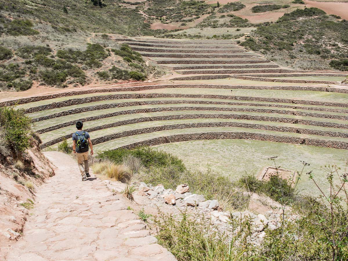 man-exploring-moray-ruins-in-maras-cusco-peru-s-2022-03-04-01-53-20-utc